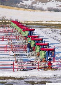 Industrial pipeline infrastructure for oil and gas operations in snowy outdoor setting.
