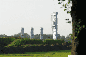 Industrial wind turbines for renewable energy at ALRDC plant site.
