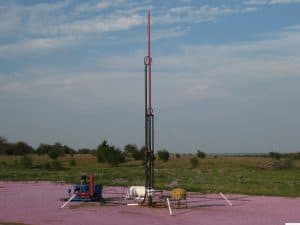 High-efficiency oil drilling rig equipment on a rural field, Texas, for oil exploration and production.