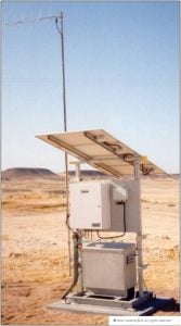 Solar-powered weather monitoring station in desert landscape.